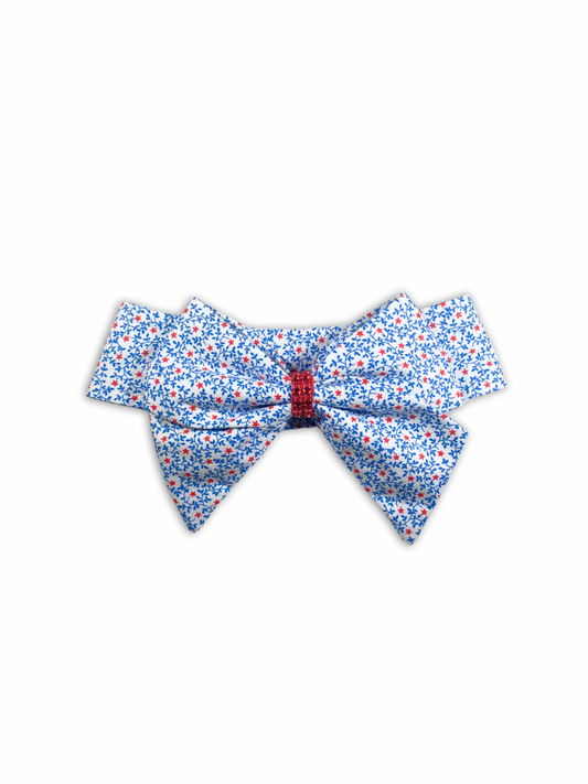 Festive red, white, and blue dog bow tie, perfect for Memorial Day celebrations. This bow tie is a stylish and patriotic way to dress up your furry friend for the holiday.